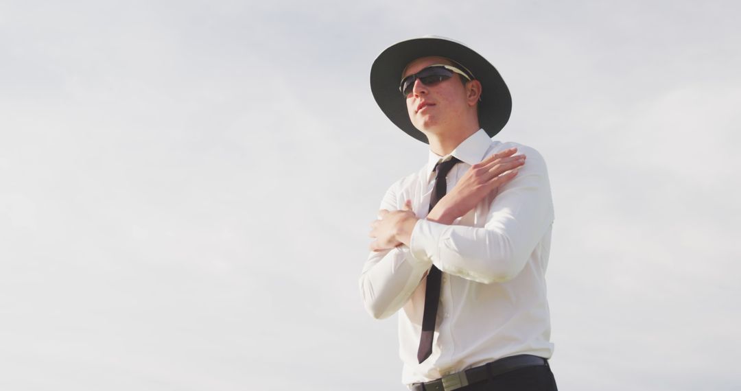 Confident Businessman Wearing Sunglasses and Hat Outdoors - Free Images, Stock Photos and Pictures on Pikwizard.com