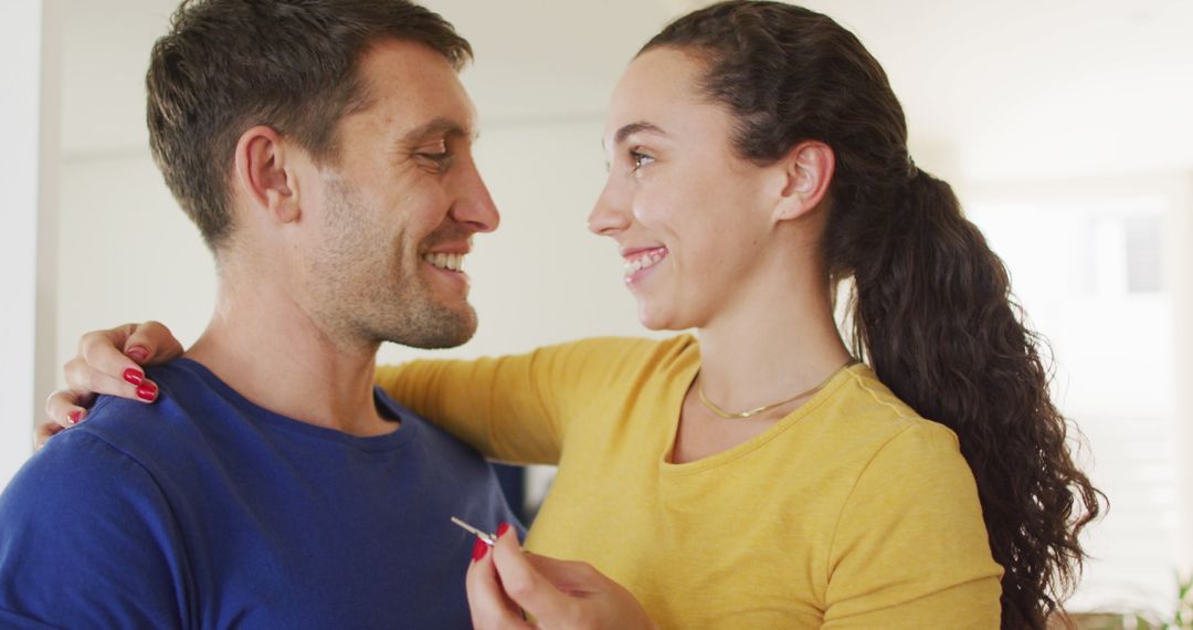Happy Couple Embracing Sharing Joyful Moments at Home