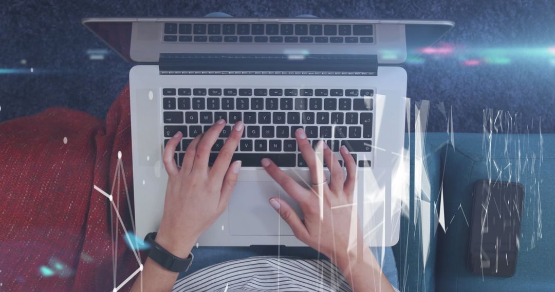 Woman Using Laptop with Digital Graphs Overlay in Home Setting