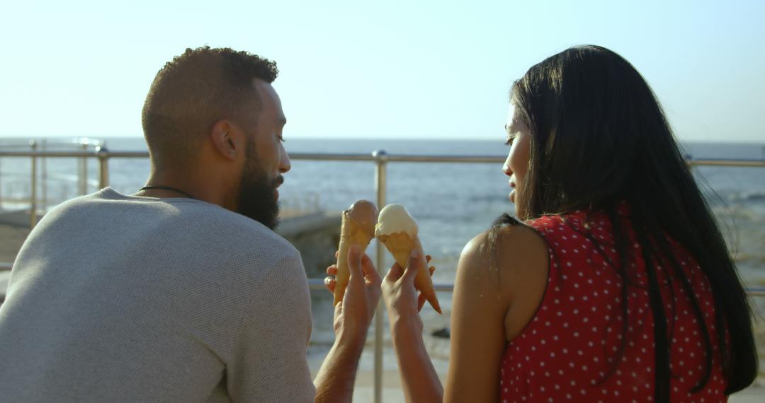 Couple Enjoying Ice Cream Cones by the Beach - Free Images, Stock Photos and Pictures on Pikwizard.com