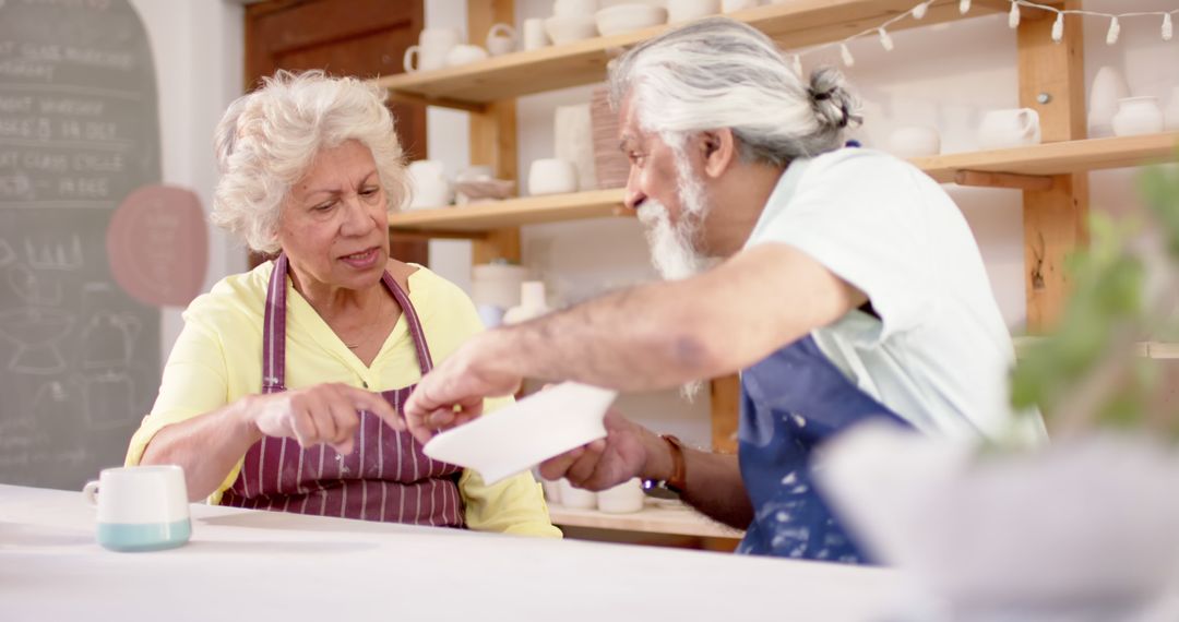 Senior Couple Engaged in Pottery Crafting Together - Free Images, Stock Photos and Pictures on Pikwizard.com