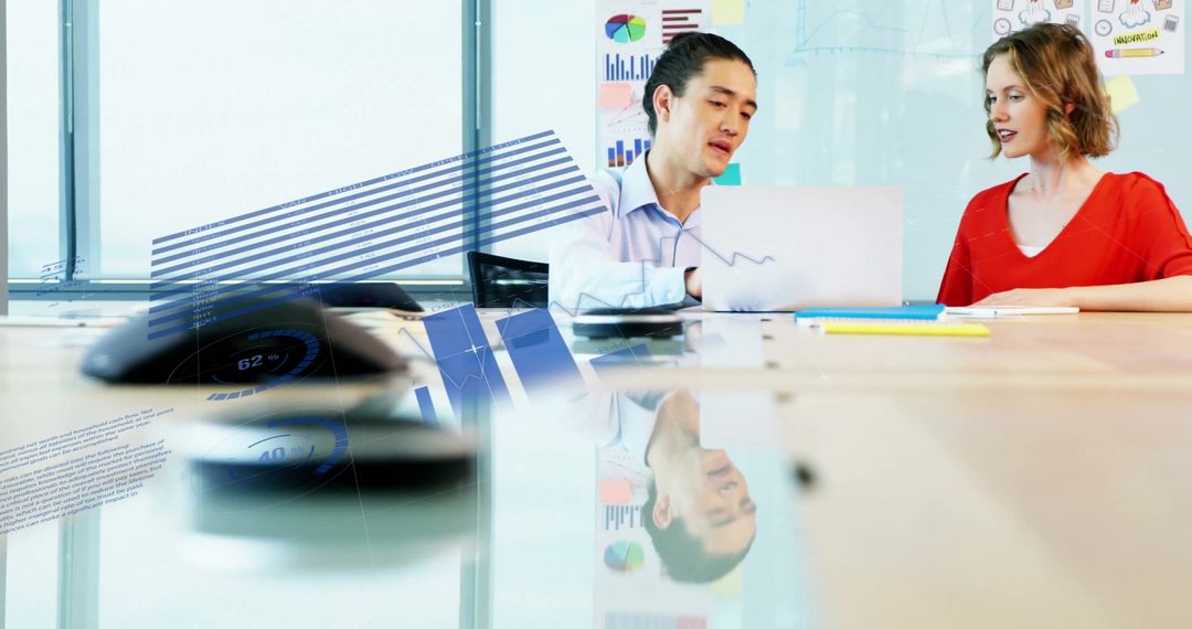 Infographic Overlay with Diverse Team Analyzing Data on Laptop