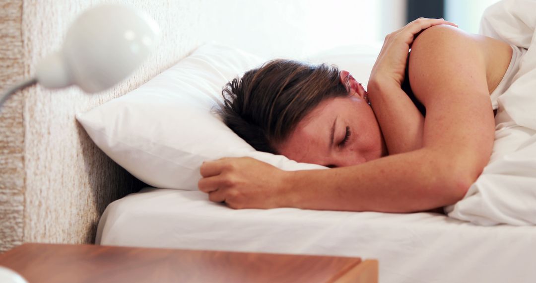 Woman Sleeping Peacefully in Cozy Bed in Bright Room - Free Images, Stock Photos and Pictures on Pikwizard.com