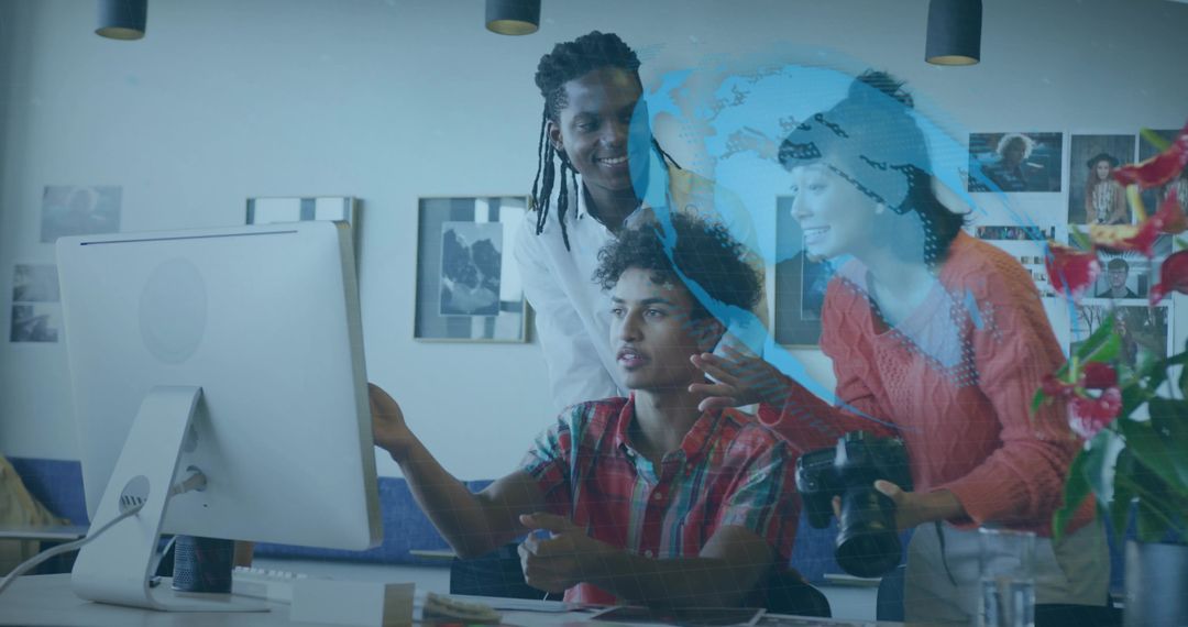 Creative team collaborating on digital design at modern studio with global data overlay