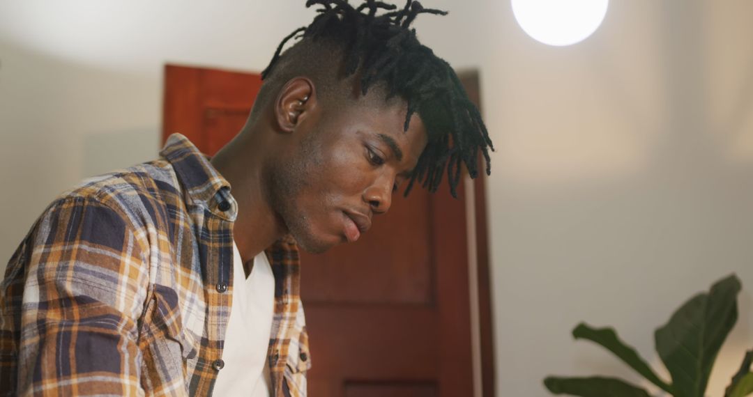 Focused African American Craftsman at Work in Workshop