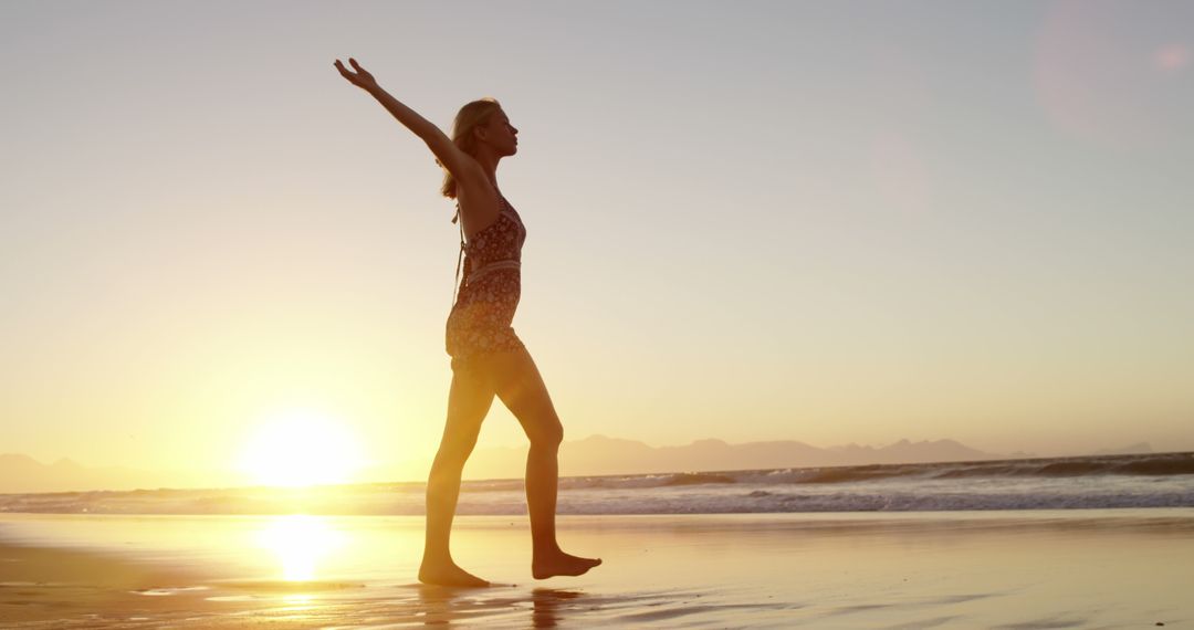 Woman Enjoying a Beach Sunset in Summer - Free Images, Stock Photos and Pictures on Pikwizard.com