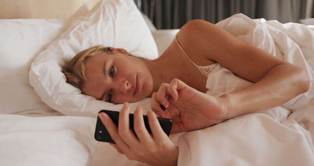 Woman Waking Up in Bed Checking Smartphone Early Morning Routine - Free Images, Stock Photos and Pictures on Pikwizard.com