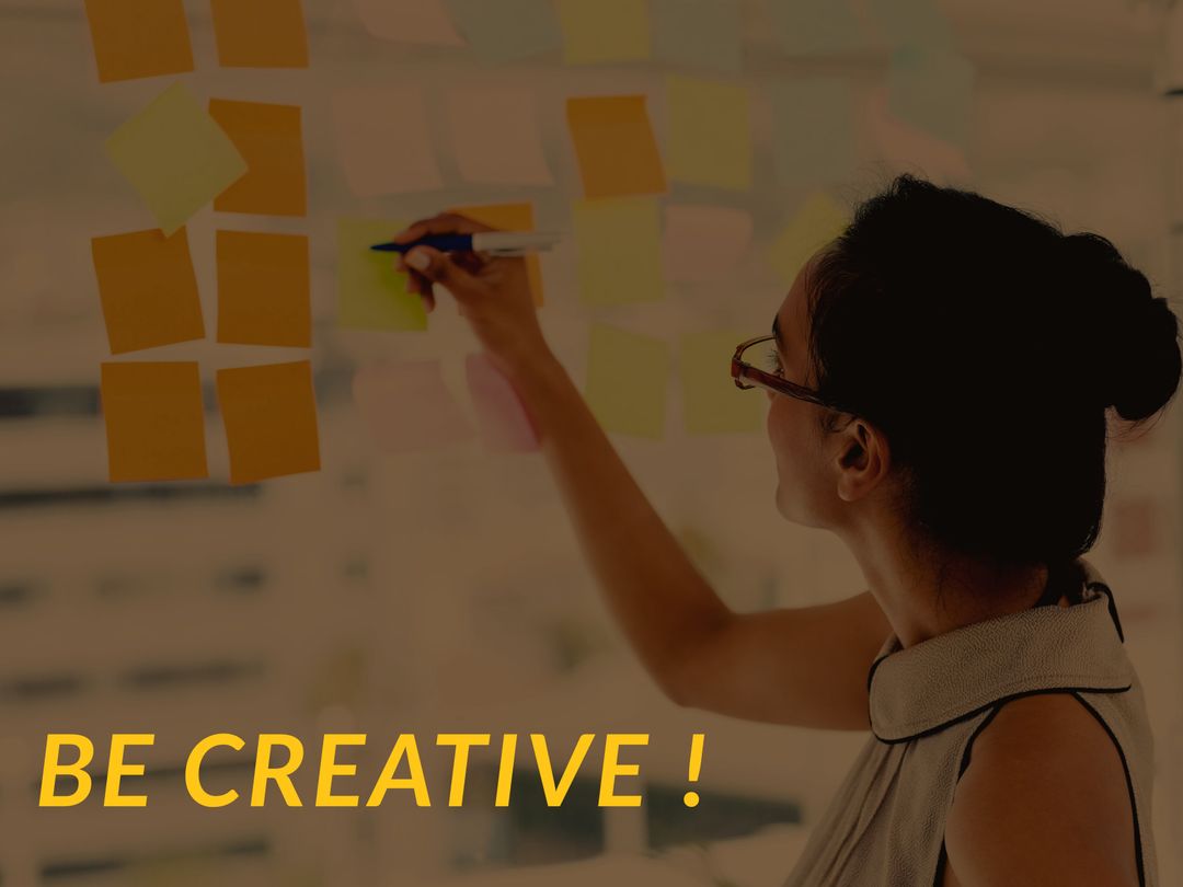 Creative Woman Organizing Sticky Notes for Innovative Strategy