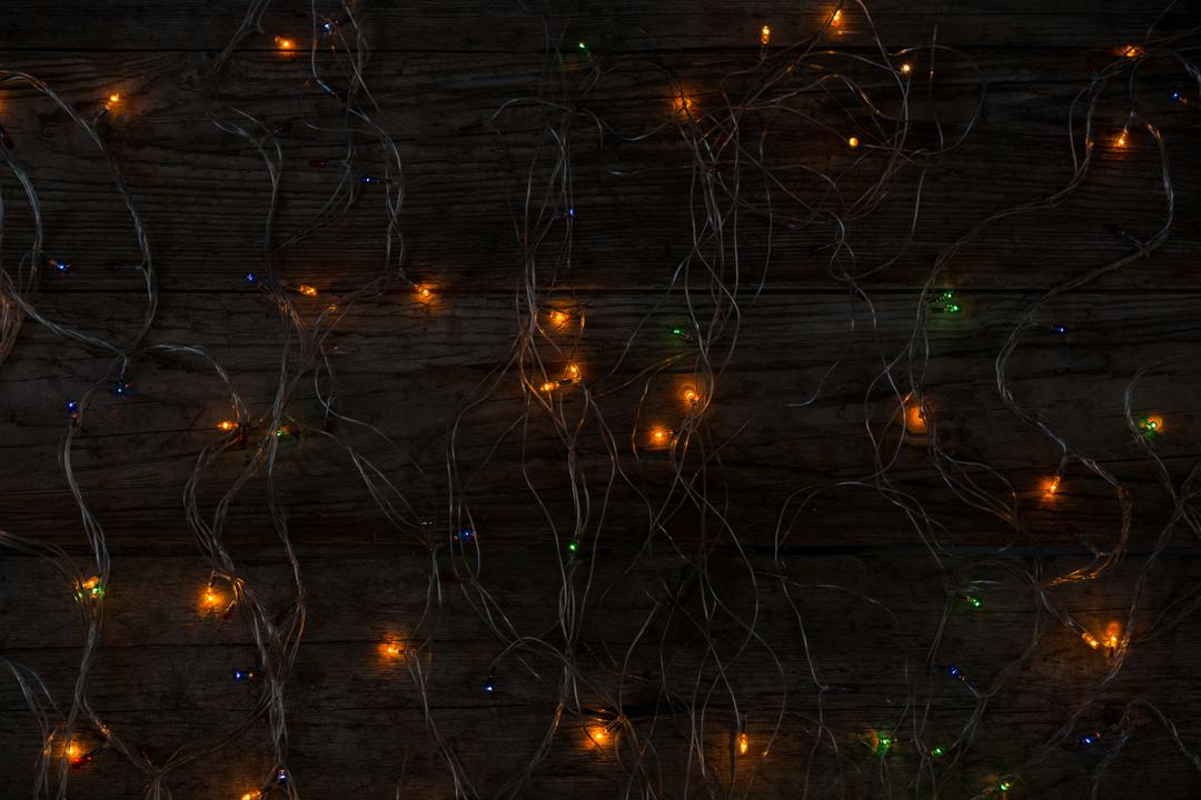 Illuminated Rice Lights on Wooden Plank During Christmas - Free Images, Stock Photos and Pictures on Pikwizard.com