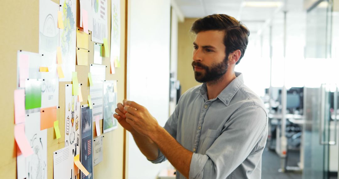 Man Preparing for Project Work at Office - Free Images, Stock Photos and Pictures on Pikwizard.com