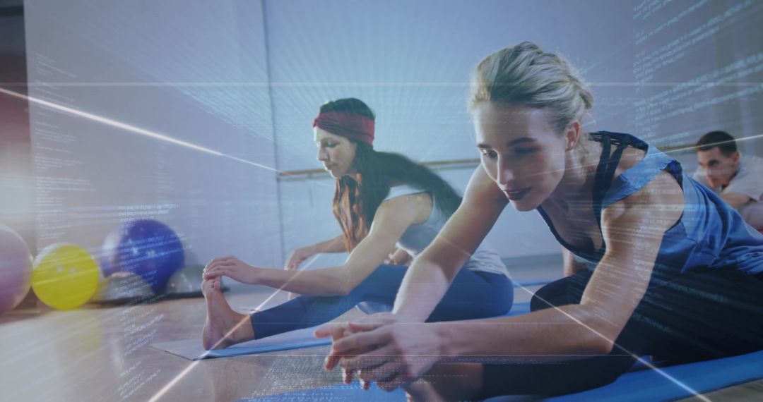 Two Women Practicing Yoga With Technology Overlay in Studio