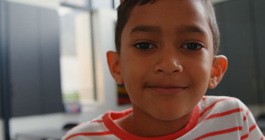 Smiling Schoolboy in Classroom