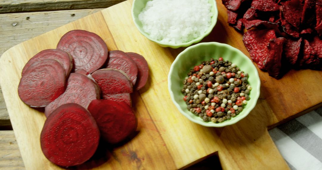 Fresh Sliced Beets with Sea Salt and Mixed Peppercorns on Wooden Board - Free Images, Stock Photos and Pictures on Pikwizard.com