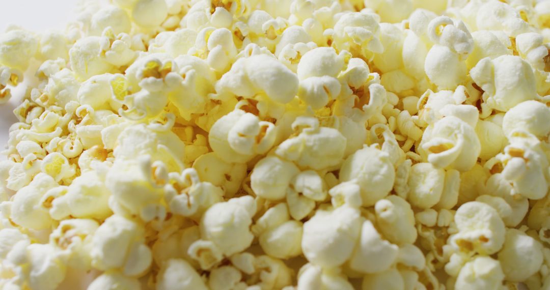 Close-Up of Freshly Popped Popcorn on White Background - Free Images, Stock Photos and Pictures on Pikwizard.com