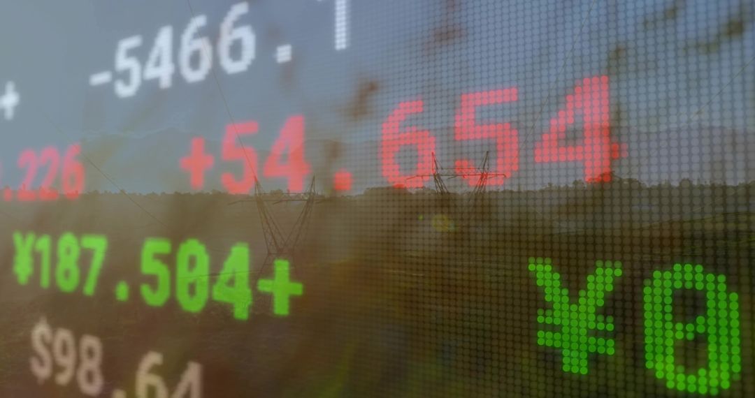 Digital finance data superimposed on rural dawn landscape