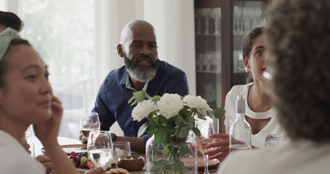 Group Enjoying Conversation Around Table at Celebration