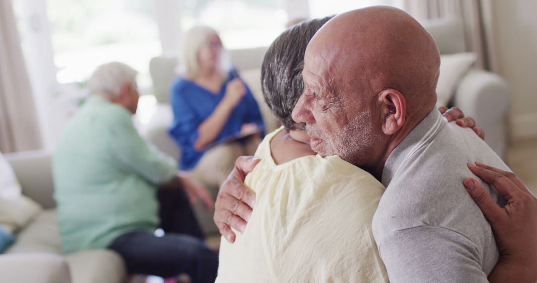Senior Couple Embracing During Group Therapy Session - Free Images, Stock Photos and Pictures on Pikwizard.com
