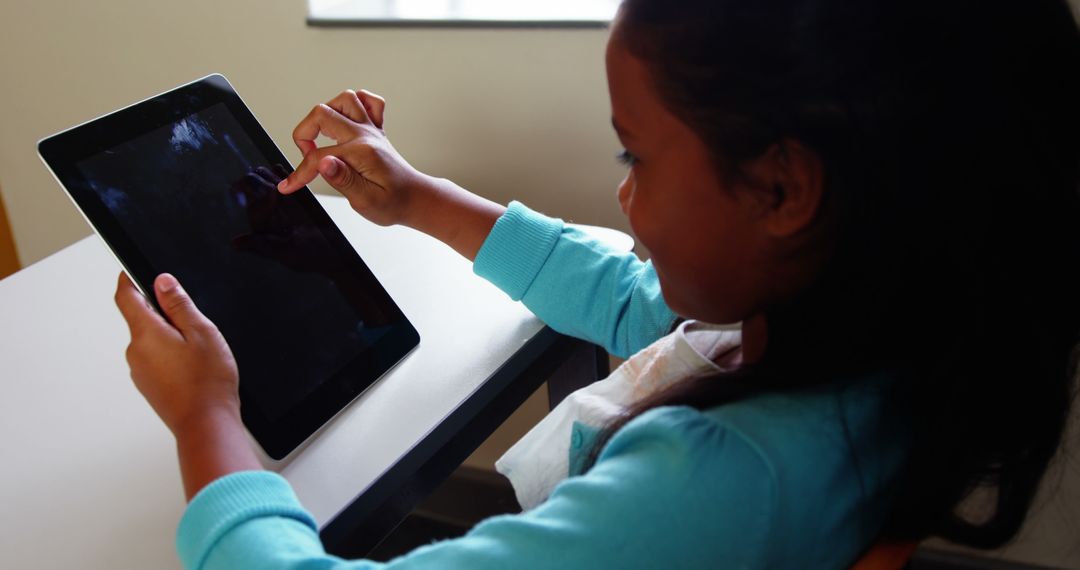 Young Girl Using Tablet for Education - Free Images, Stock Photos and Pictures on Pikwizard.com