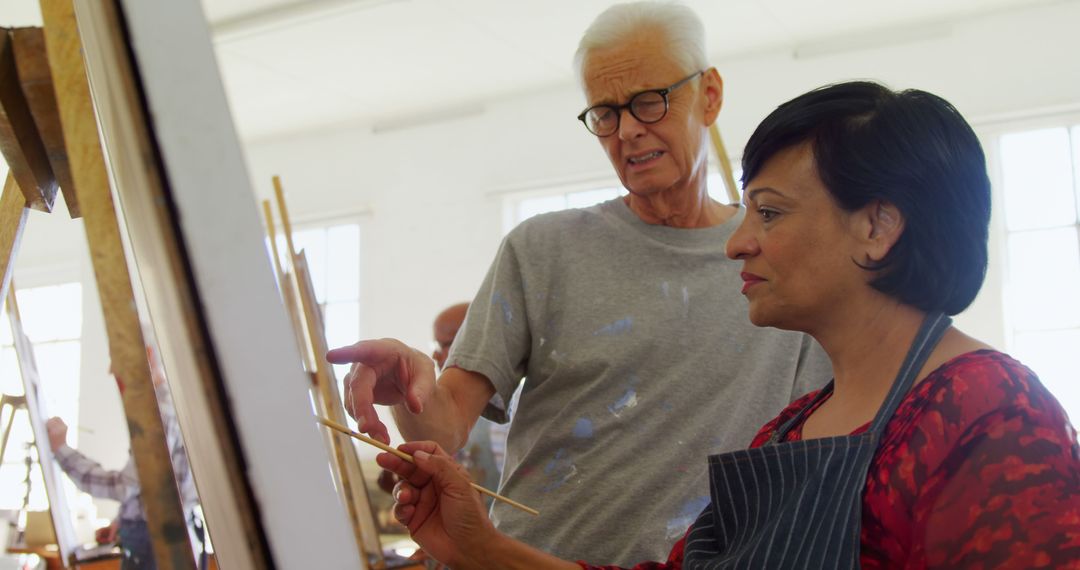 Senior Adults Engaging in Painting Class at Art Studio - Free Images, Stock Photos and Pictures on Pikwizard.com