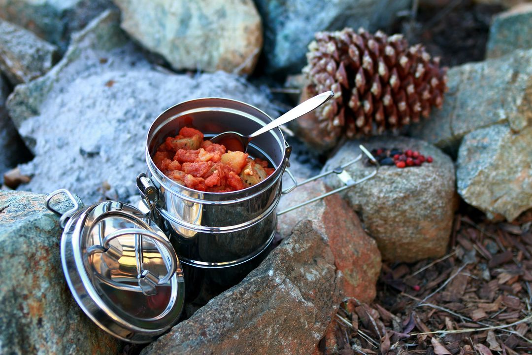 Outdoor Picnic with a Tiffin Box of Stew and Boulders