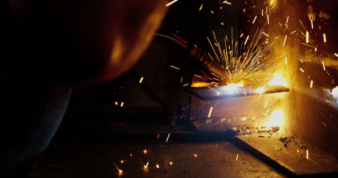 Close-Up of Welding Process with Bright Sparks in Industrial Workshop - Free Images, Stock Photos and Pictures on Pikwizard.com