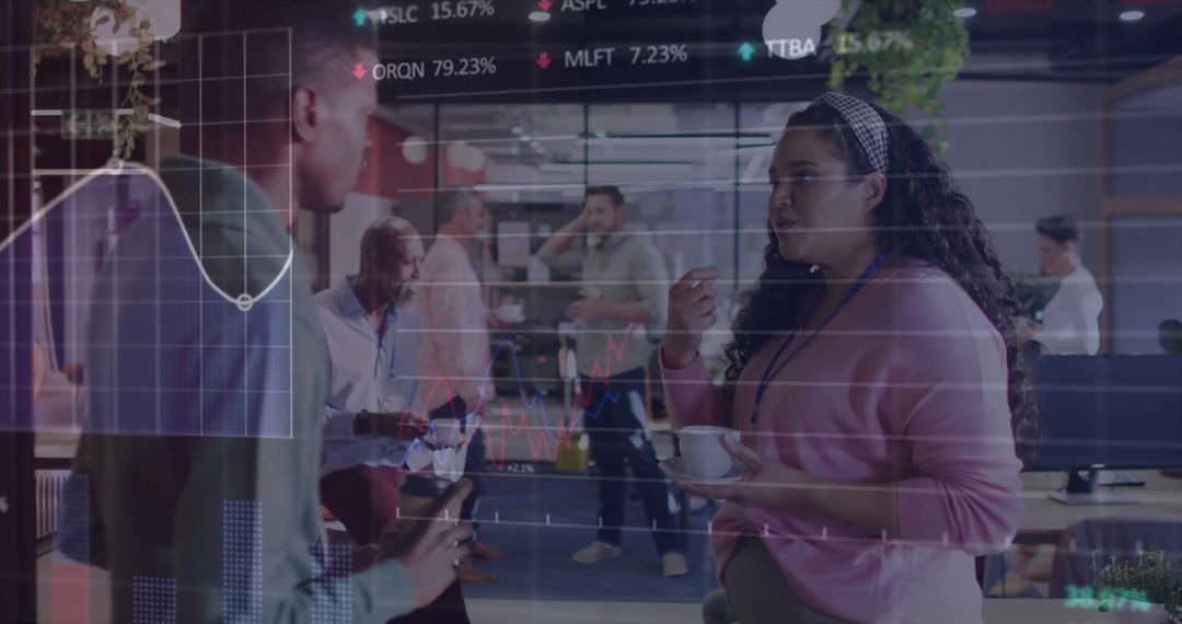 Diverse Colleagues Analyzing Data in Modern Office with Digital Charts Overlay