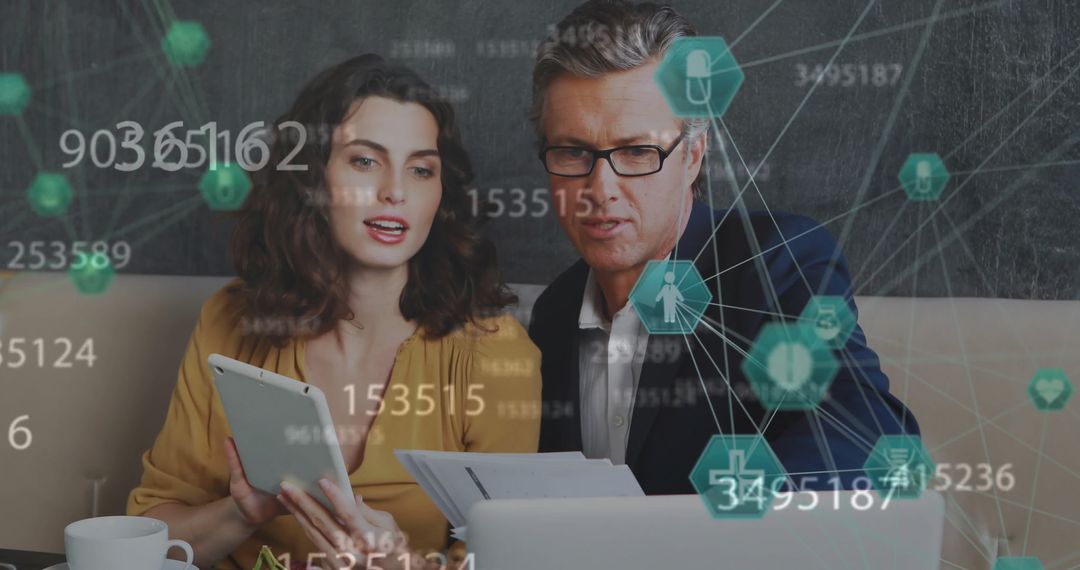 Business People Analyzing Digital Interface with Medical Data Visualization