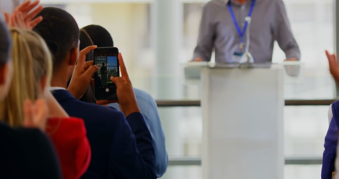 Audience Applauding Speaker at Business Seminar