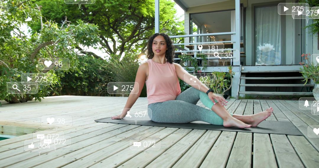 Practicing Twist Yoga on Wood Deck with Smartwatch and Social Media Overlays, Wellness