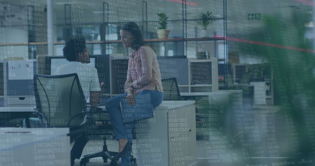 Coworkers Analyzing Code with Overlay in Modern Office Setting