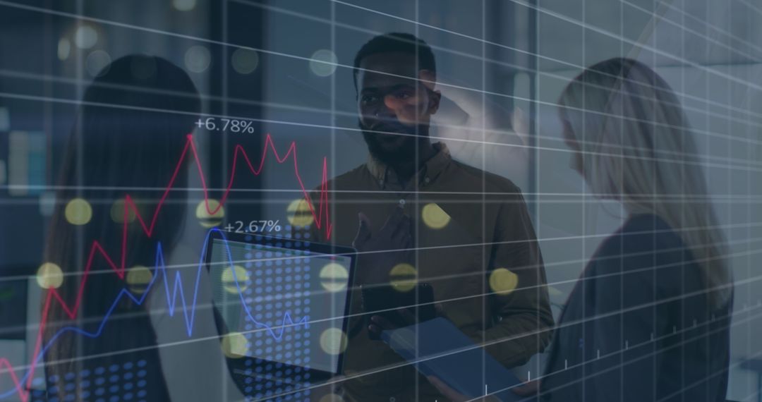 Diverse Colleagues Analyzing Financial Graphs in Modern Office