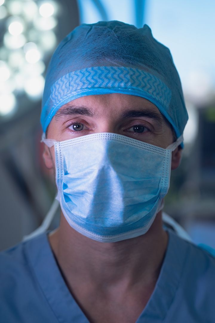 Portrait of Male Surgeon in Surgical Mask in Hospital Operating Room - Free Images, Stock Photos and Pictures on Pikwizard.com