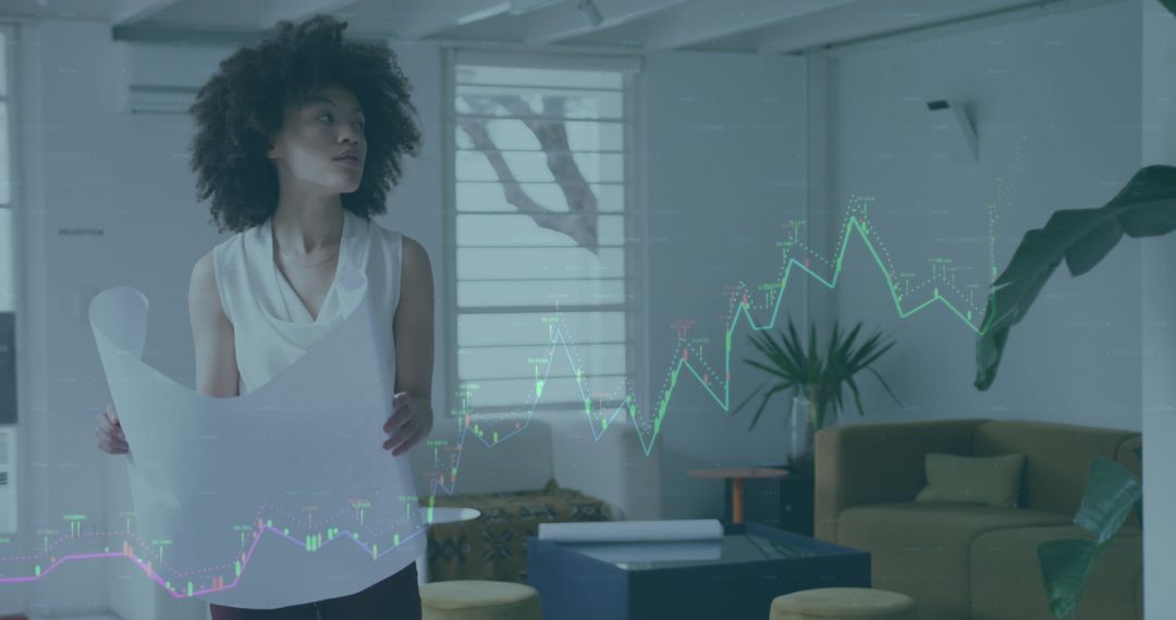 Businesswoman Analyzing Financial Data with Virtual Graphs