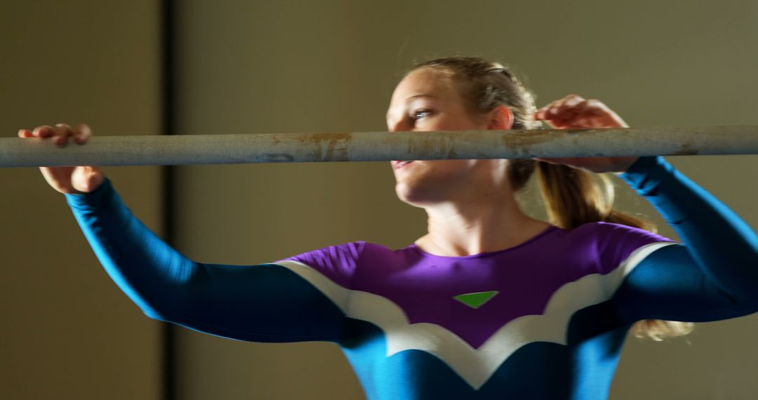 Female Gymnast Practicing on Uneven Bars for Competition - Free Images, Stock Photos and Pictures on Pikwizard.com