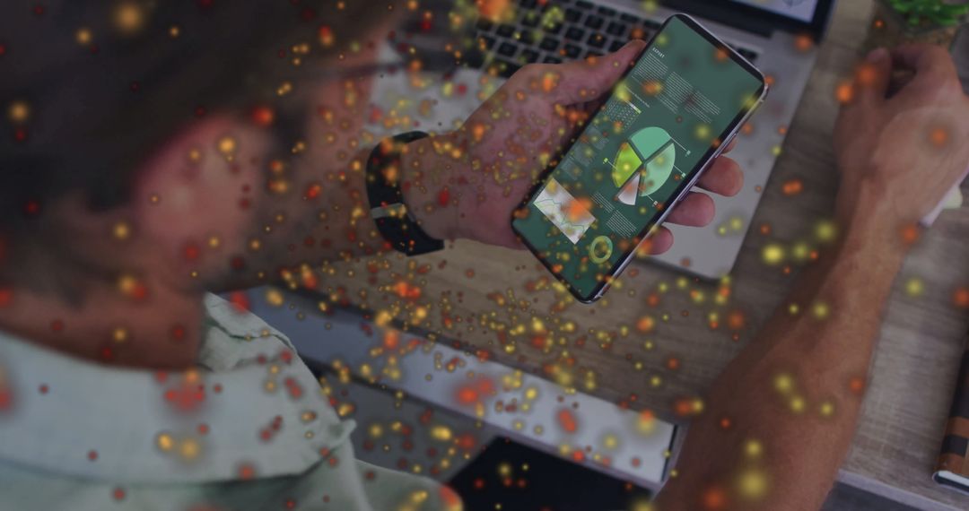 Man Analyzes Data on Smartphone at Desk with Tech Elements