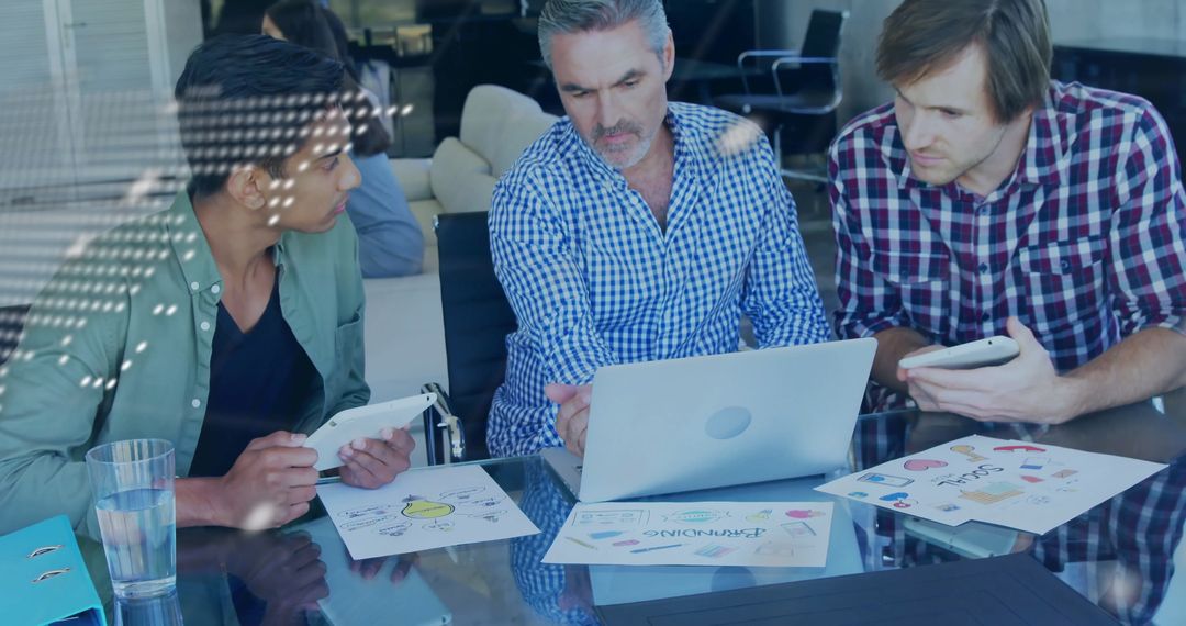Diverse Colleagues Collaborating in Modern Office on Digital Strategies