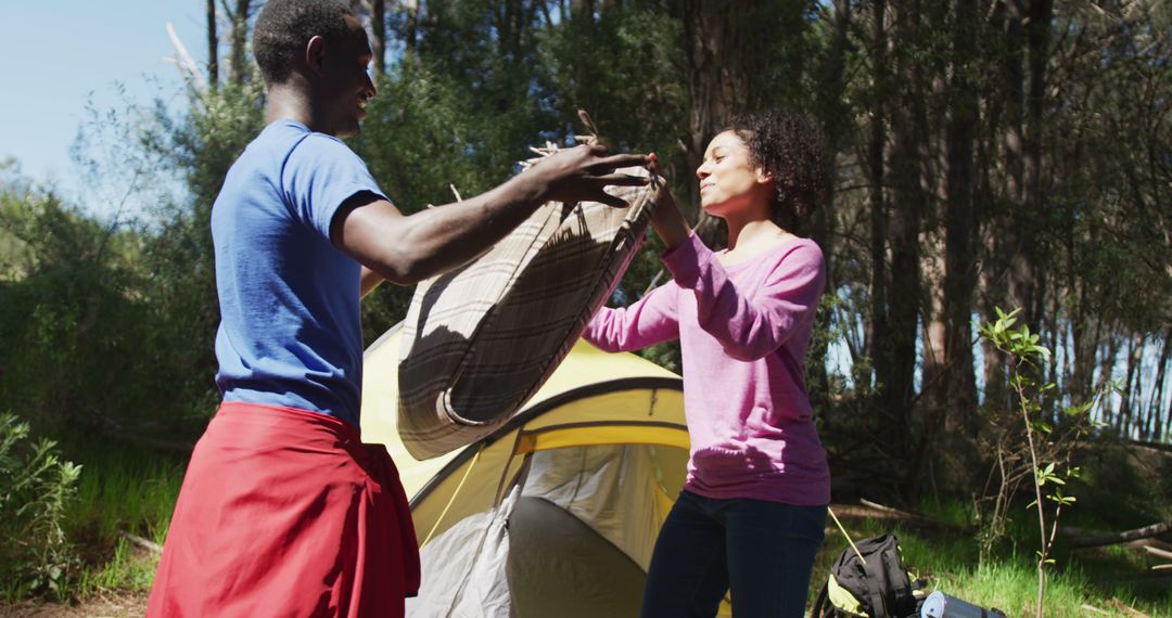 Couple Setting Up Tent in Forest Camping Trip - Free Images, Stock Photos and Pictures on Pikwizard.com