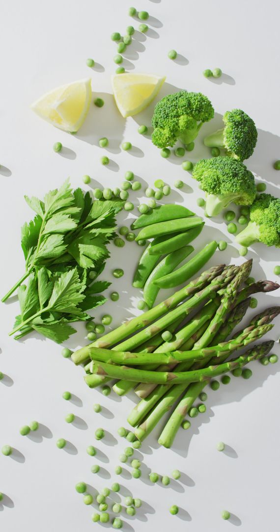 Assorted Fresh Green Vegetables on White Background
