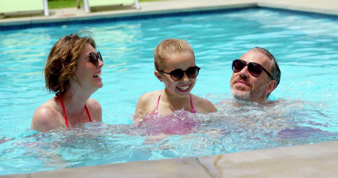 Family Enjoying Swimming Pool on Sunny Day - Free Images, Stock Photos and Pictures on Pikwizard.com