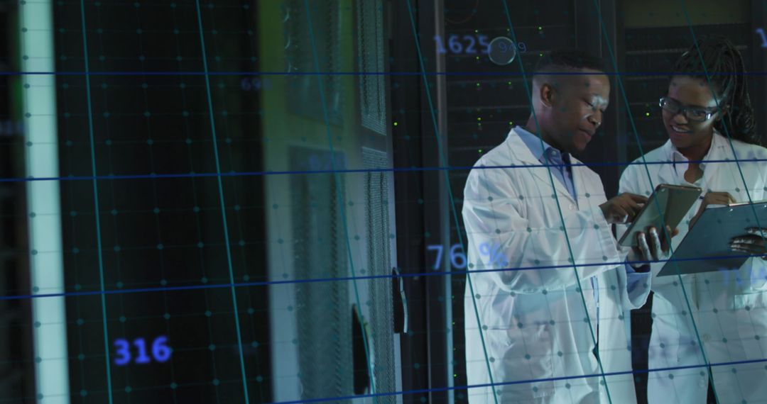 Researchers Analyzing Data in High-Tech Server Room