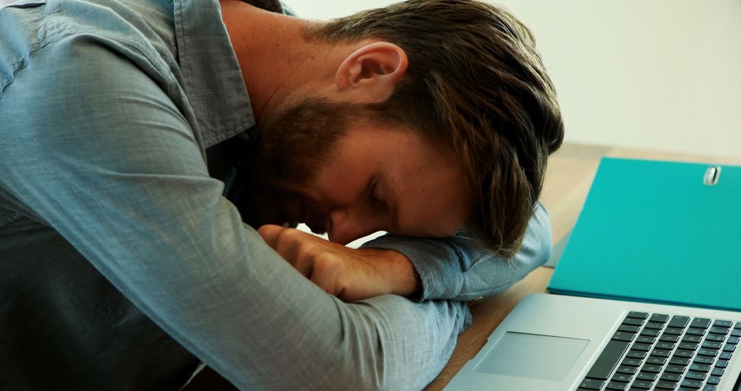 Exhausted Man Napping at Desk After Working Hard - Free Images, Stock Photos and Pictures on Pikwizard.com