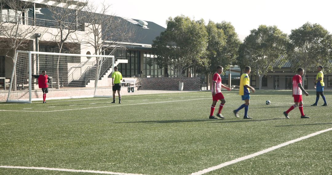 High School Soccer Players Preparing for a Free Kick in Sunny Field