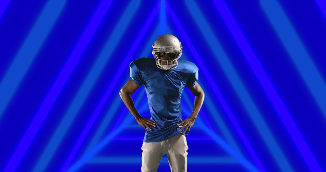 Athlete in Gear Posed Against Abstract Blue Triangle Design