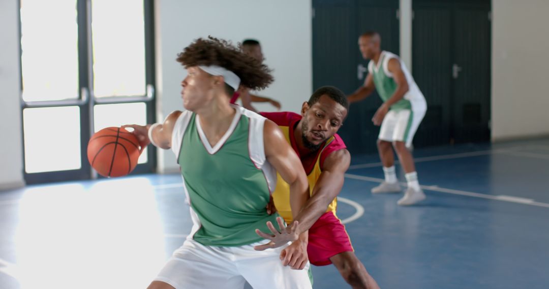 Intense Basketball Match With Diverse Team In Action