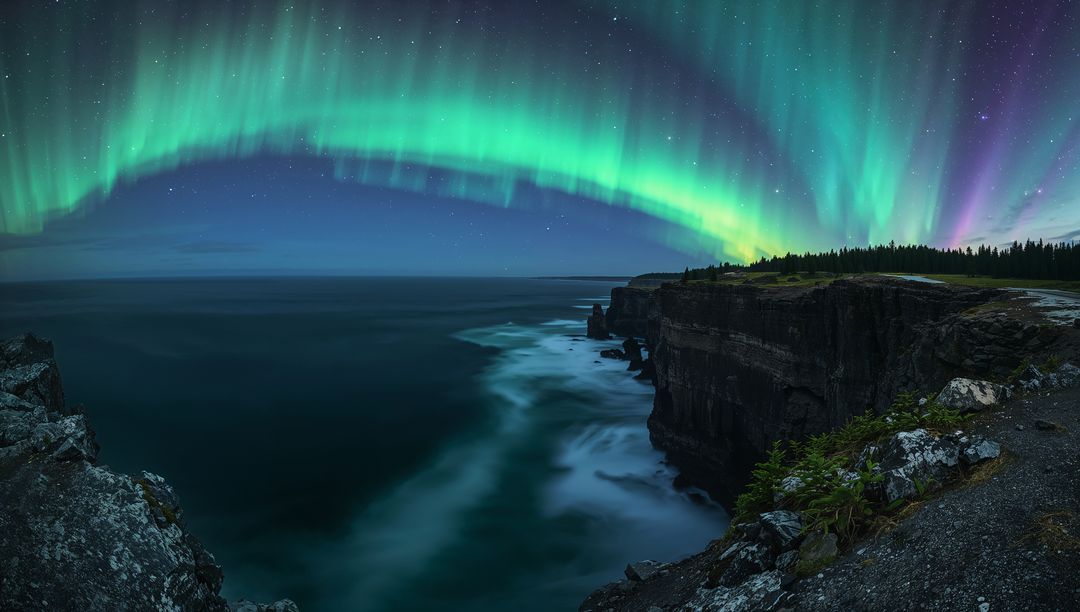 Arching Aurora Borealis Over Rugged Coastal Cliffs and Misty Ocean Under Starlit Sky Glow