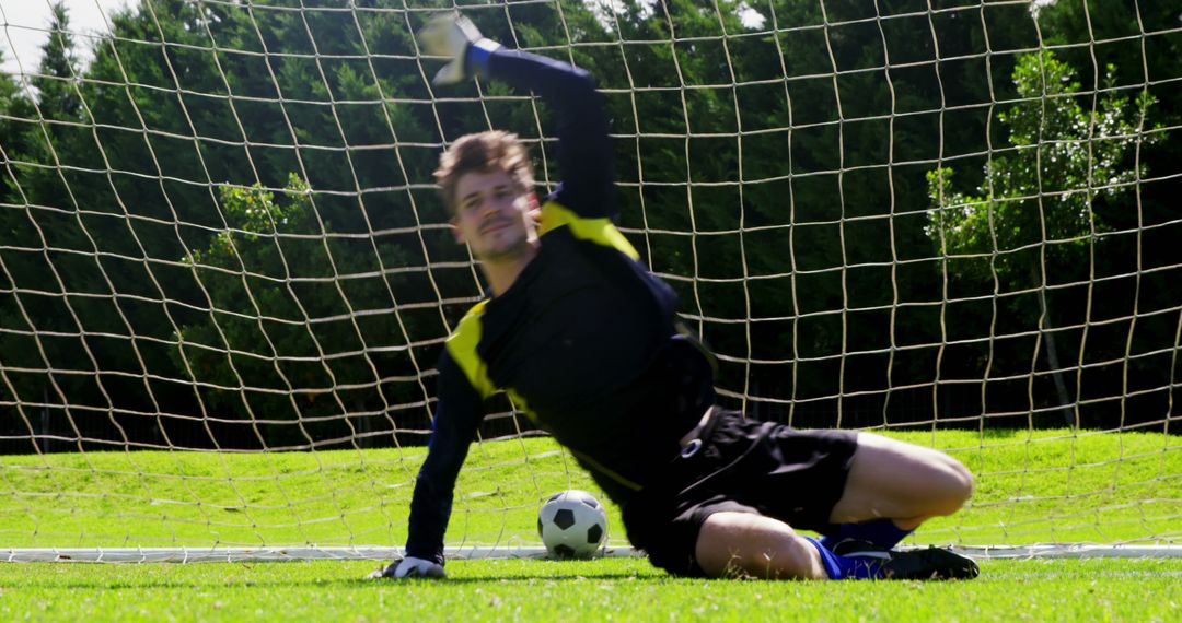 Soccer Goalkeeper Diving to Make Save During Game - Free Images, Stock Photos and Pictures on Pikwizard.com