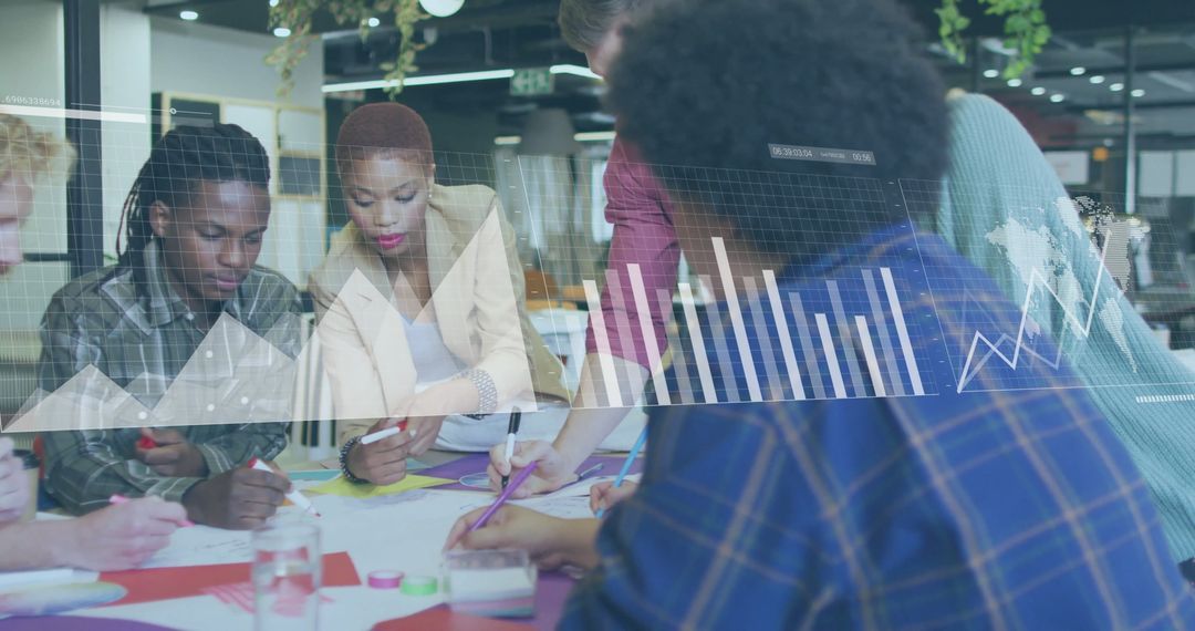 Diverse Team Analyzing Financial Graphs in Modern Office Environment