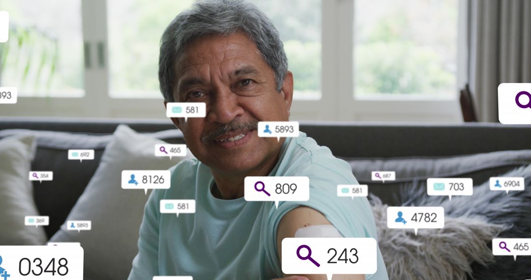 Senior Man Interacting with Social Media Icons at Home