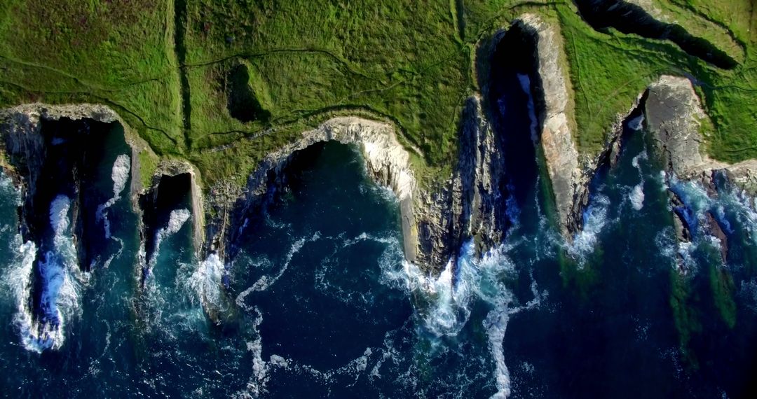 Aerial View of Rugged Northern Coastline with Powerful Waves - Free Images, Stock Photos and Pictures on Pikwizard.com