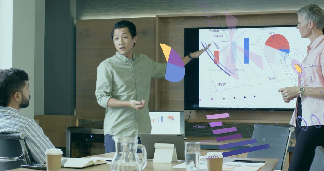 Multiracial Team Discussing Data Visualization in Modern Office